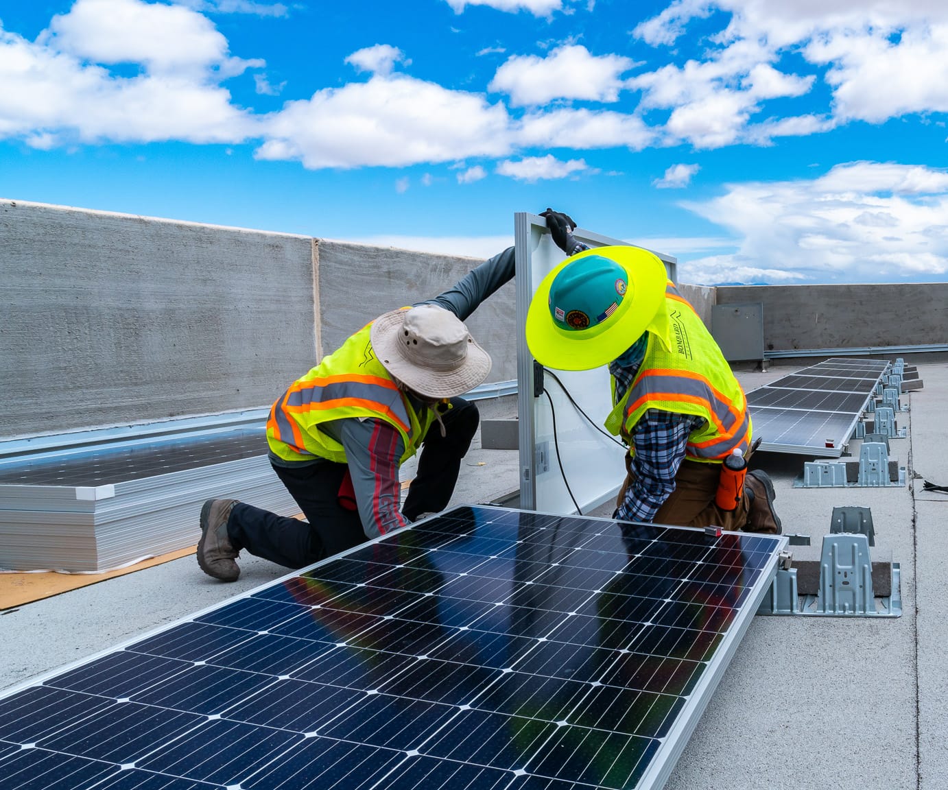 employees installing solar array